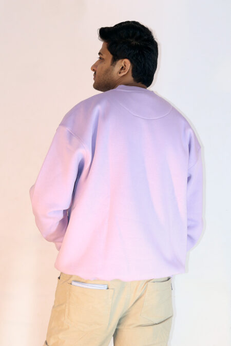 "Oversized lavender sweatshirt made from soft cotton fleece, offering a relaxed fit and ultimate comfort for casual and trendy looks."